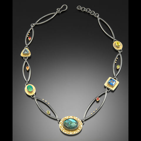 One of a kind collar with five gemstones set in 18k gold.