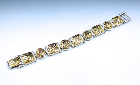 Gold eternity knot set in sterling silver bracelet